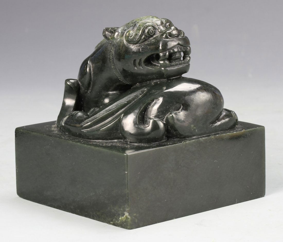 Chinese Black Jade Seal Chop: China, 19th C., black jade seal chop featuring tiger-like creature with toothy grin . Height 4 in., Width 4 1/4 in.