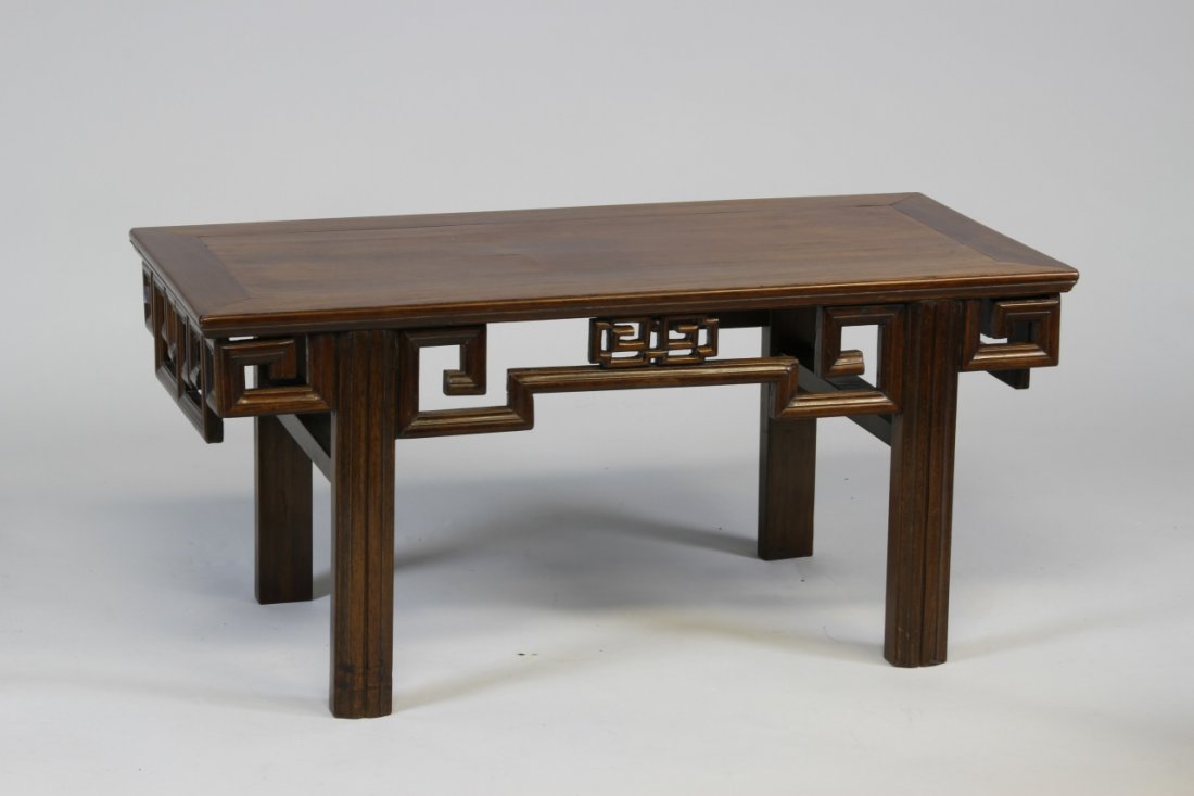 Chinese Huanghuali Low Altar Table: China, carved Huanghuali wood rectangular low altar table, cut down, with an elaborately carved apron with geometric motif Width 36 1/2 in., Height 17 in., Diameter 16 1/4 in.
