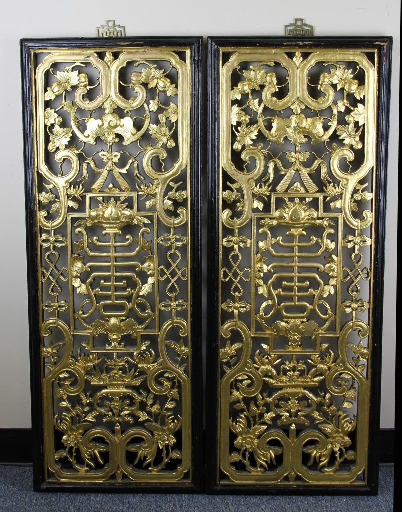 Pair of Chinese Gilt Window Panels: China, a pair of expertly carved gilt window panels, with floral motifs and scrolling designs, with brass fixtures. Length 40 in. Width 15 1/4 in.