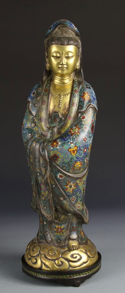 Chinese Cloisonne Guanyin: China, cloisonne figure of Guanyin, in bright flowing robes, standing on a base of swirling clouds. Height 20 3/4 in.