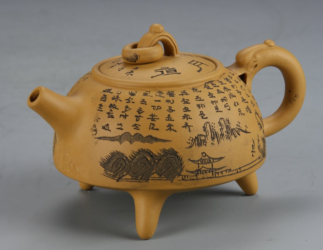 Chinese Yixing Teapot, Zhou Gui Zheng: China, Yixing tripod teapot, decorated with incised and painted calligraphy and a mountain landscape scene, attributed to Zhou Gui Zheng. Height 4 in., Width 6 in.