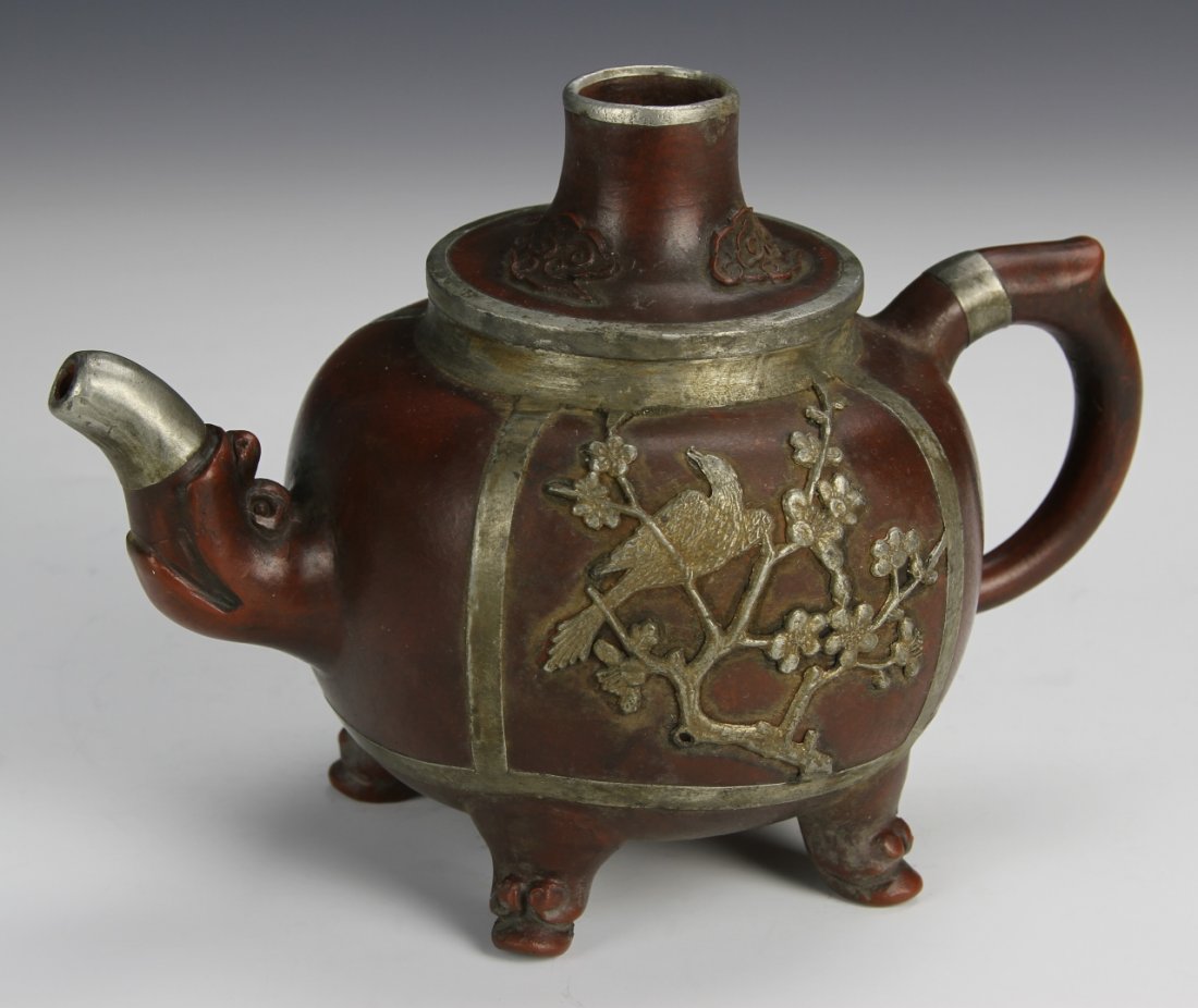 Chinese Yixing Teapot: China, 20th C., Yixing tea pot with metalwork decorations of birds perched in trees. Height 5 in., Width 7 in.