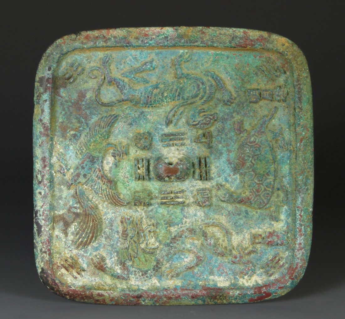 Chinese Mirror: China, Han Dynasty, square-shaped mirror with carvings of various animal-creatures. Width 5 1/2 in., Length 5 1/4 in.