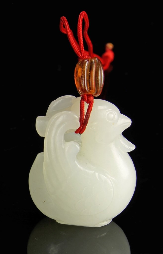 Chinese Carved Jade Pendant: China, Song Dynasty, carved mutton fat jade in form of Mandarin duck with sweeping feathers, complete with red tassel . Height 1 1/2 in. Provenance: Private Collection of Mr. Kwong and Mr. Lin, Macau
