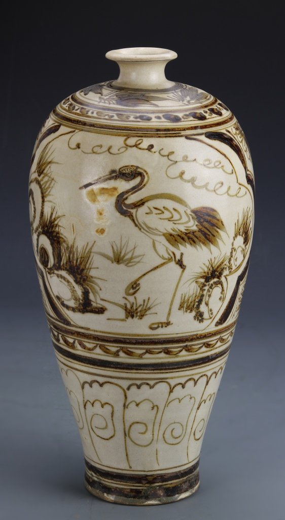 Chinese Cizhou Ware Meiping Vase: China, Jin/Yuan Period, Cizhou ware Meiping vase, with a loosely rendered crane in a garden setting, and banded patterns around the body. Height 13 in.