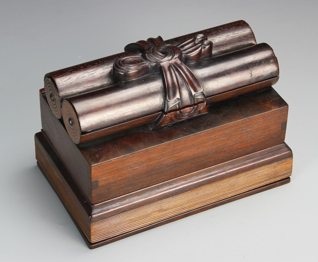 Chinese Zitan Scholar Box: China, Zitan wood scholar box, two scrolls, elegantly tied with ribbon, sit upon two books, the top and base both slide open to show dividing drawers, natural wood grain and color featured throughout,