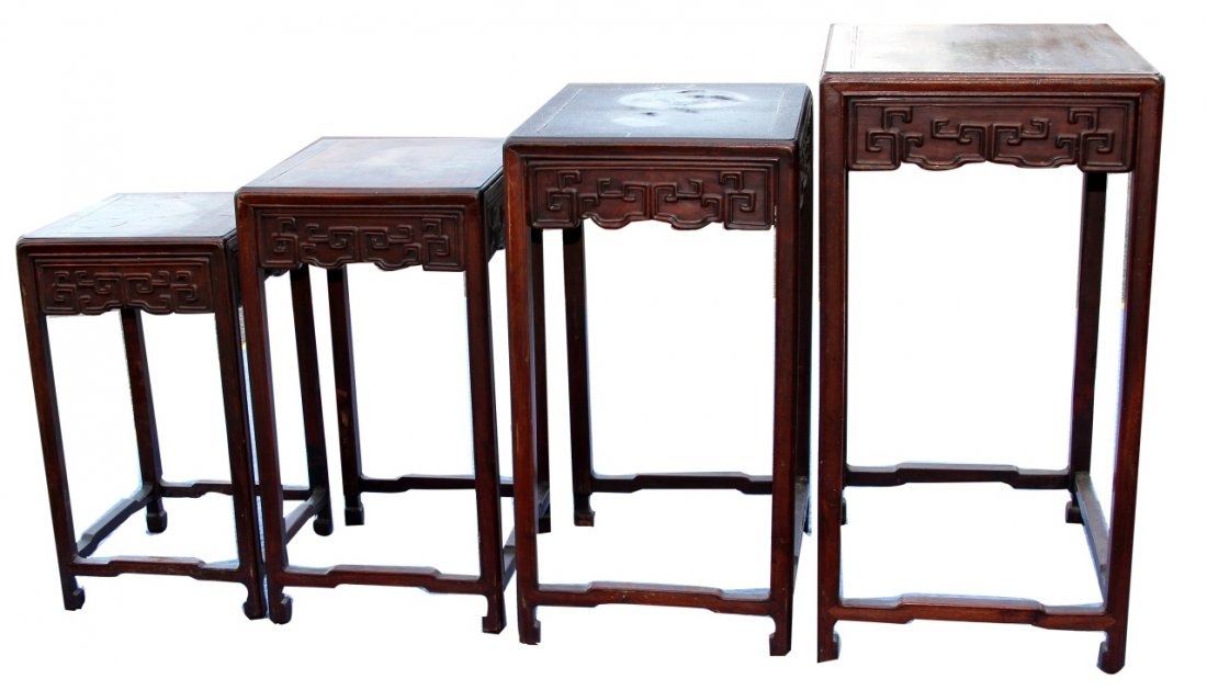 Four Chinese Huanghuali Nesting Tables: China, 19th C., set of four Huanghuali nesting tables, with traditional carved aprons, hoofed feet and stretchers at the base. Largest Height 26 in., Width 18 in., Length 13 3/4 in.