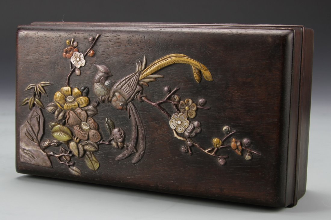 Chinese Hardwood Box: China, hardwood box, oblong shape in deep rich brown wood, everted rim and base, fitted lid that has stone inlay decoration of two birds on a flowering lotus tree branch. Length: 8 1/2 in., Height: 3 
