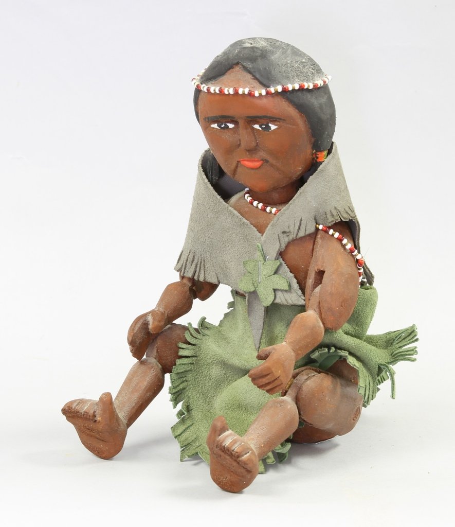 American Folk Art Articulated Wood Doll: America, folk art wood doll of an Indian maid, painted, adorned with beads and green buckskin, signed JJ Mathey, 1978 carved on back, Bouckville NY artis. Height 8 in.