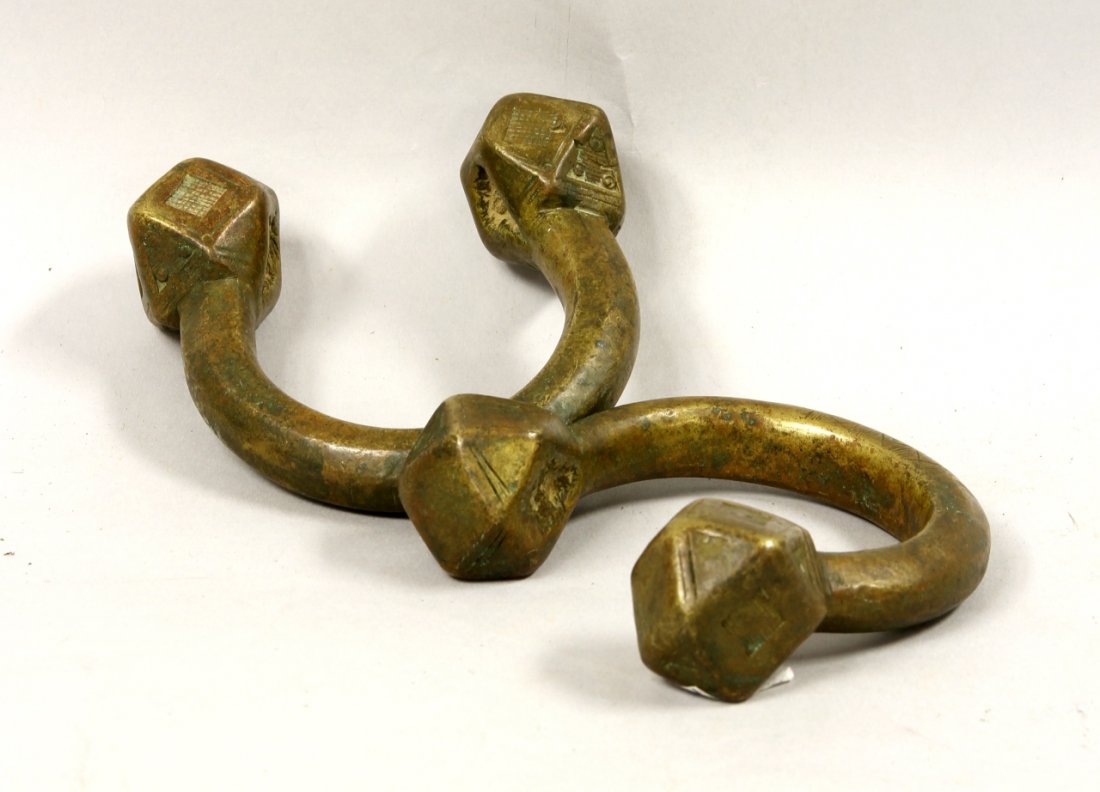 Tuareg Bronze Anklet Cuffs: Tuareg (North Africa Sahara), heavy antique bronze anklet cuffs, with a geometric design on the multi-sided ends. Length 4 in., Width 3 3/4 in.