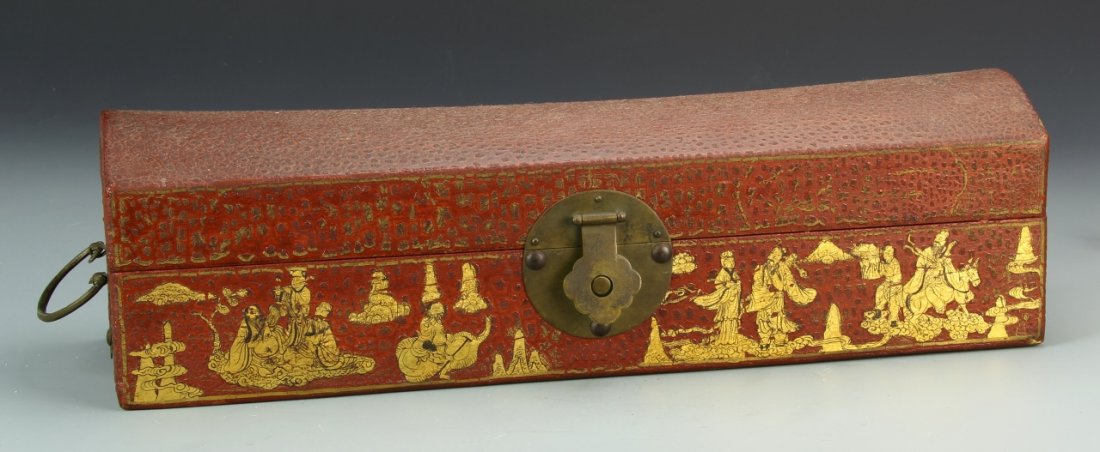 Chinese Leather Scholar Box and Gilt Immortals: China, 19th C., red leather scholar box featuring a decorative metal clasp and images of eight gilt immortals along side. Length 7 1/4 in., Width 5 in., Height 5 in.