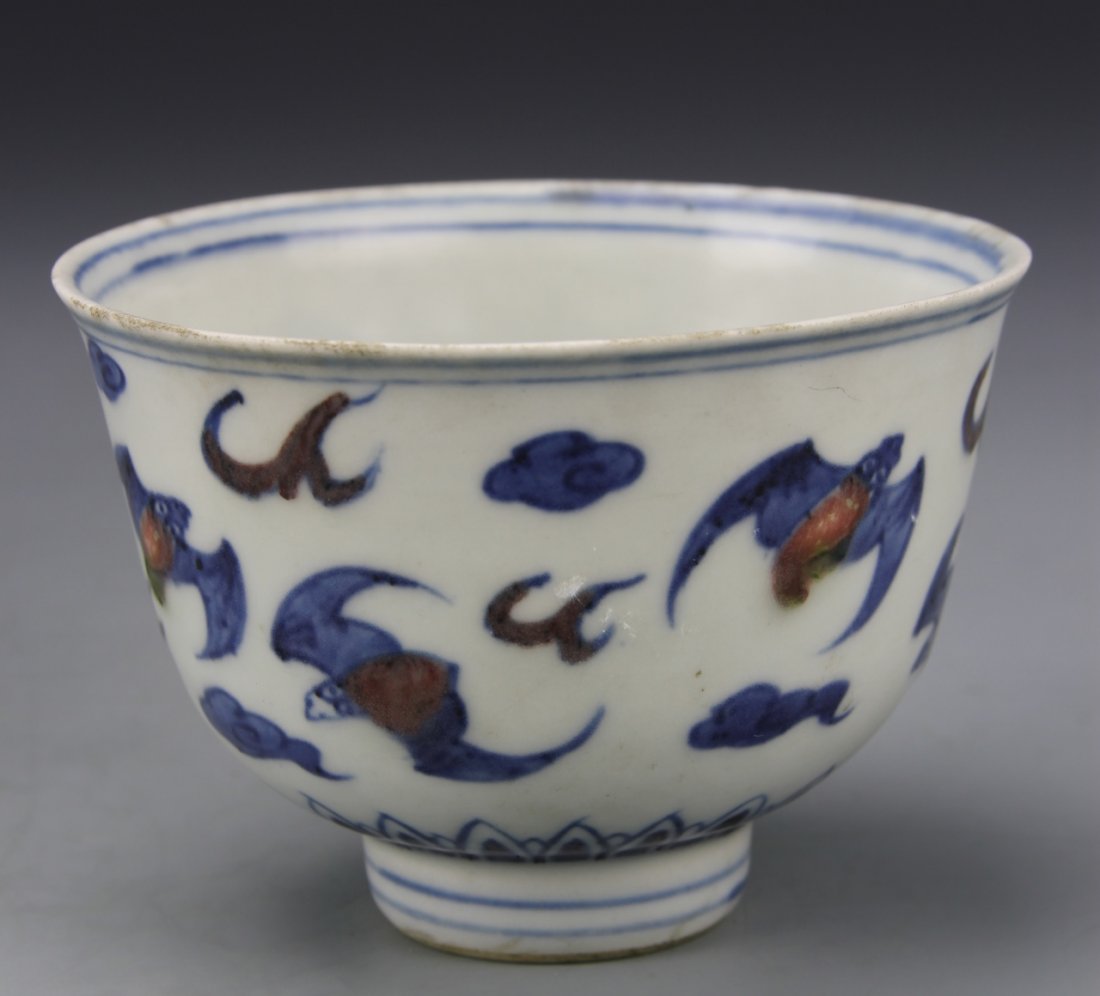 Chinese Blue, White, and Red Bowl: China, blue, white, and red bowl, with a footed base, decorated overall with bats and auspicious symbols. mark on base. Height 2 1/2 in., Diameter 3 1/2 in.