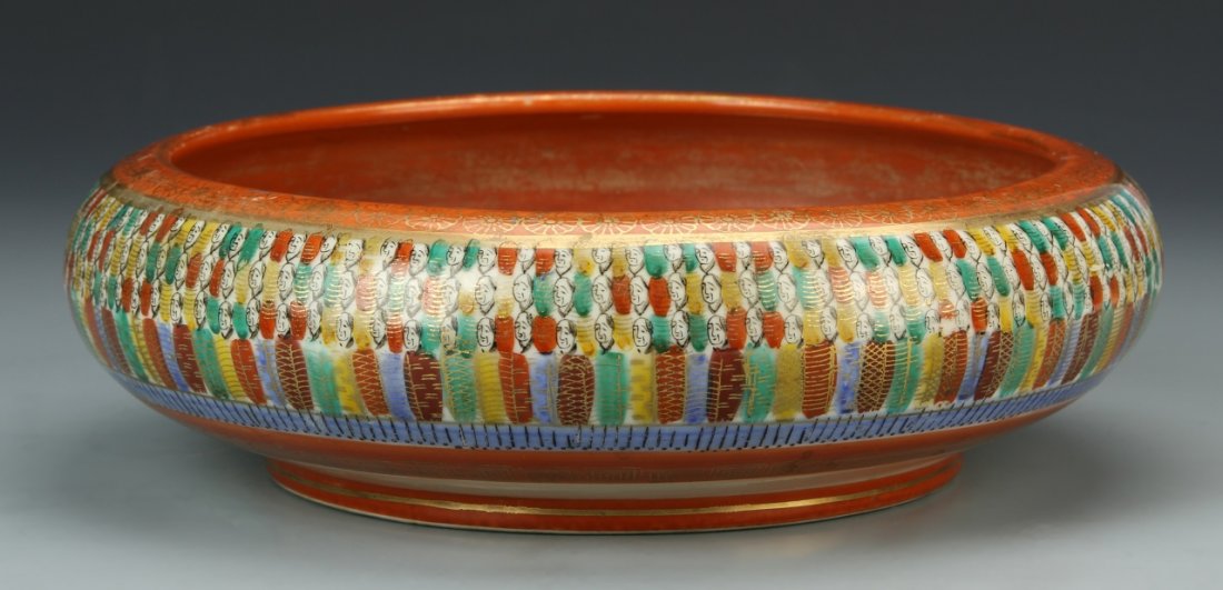 Japanese Kutini Ware Brush Washer: Japan, 19th C., Kutini ware brush washer, outside decorated in a colorful pattern of repeated figures showing all of their faces, inside continues same pattern with a central blue circle and gilt desi