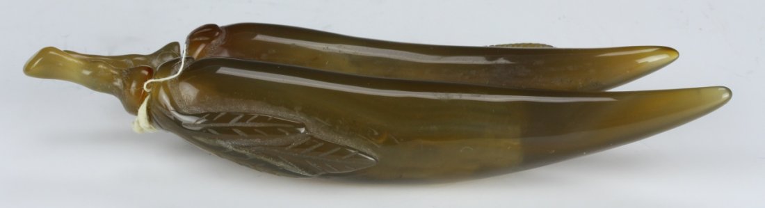 Chinese Agate Snuff Bottle: China, 19th C., rare carved agate snuff bottle in the form of two joined double peppers, with stopper that imitates the stem of the peppers. Length 5 in.