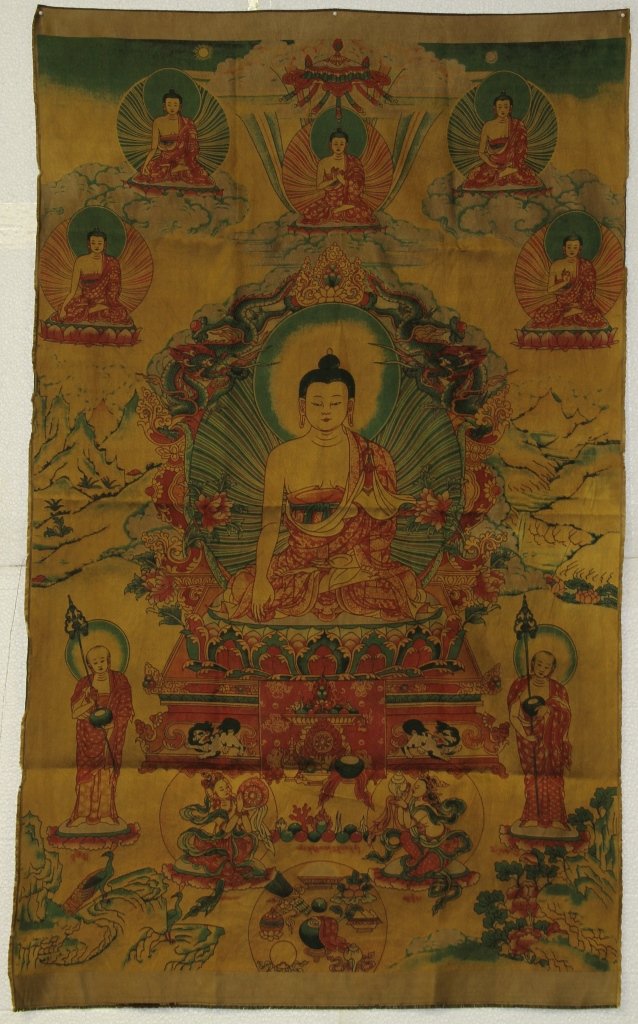 Tibetan Silk Woven Thangka of Buddha: Tibet, 19th century, The finely woven Thangka depicting a center Buddha seated in dhyanasana on a lotus base over a lion throne, his hand held across the waist in dhyanamudra and wearing heavy patchwo