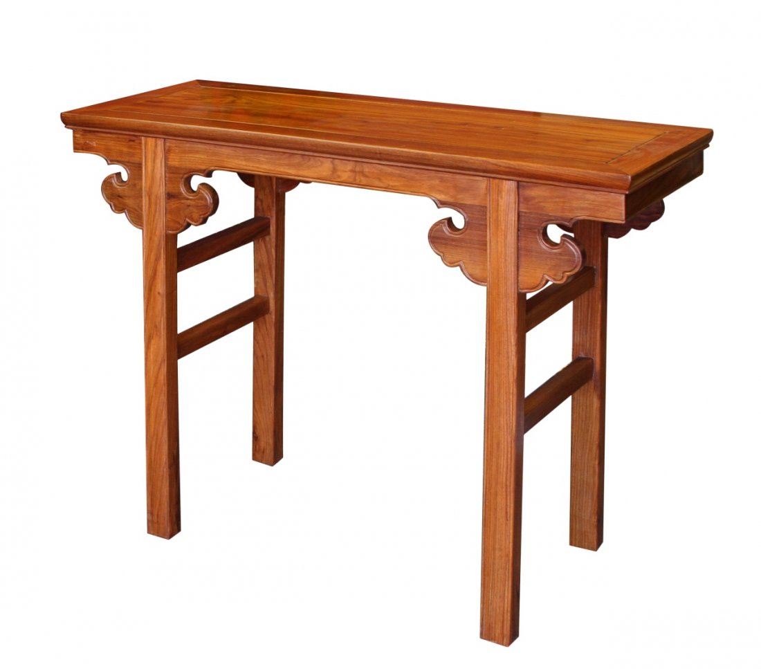 Chinese Huanghuali Altar Table: China, expertly carved Huanghuali altar table, with traditional geometric brackets, and a rectangular apron around the top. Length 42 in., Height 33 in., Width 16 in.