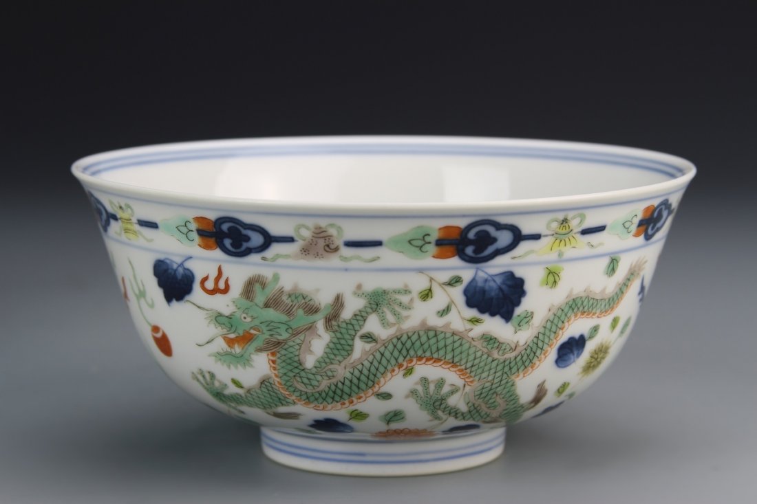 Chinese Doucai Bowl: China, Doucai bowl with footed base, decorated with painted depictions of flowers, phoenixes, and five-clawed dragons, Daoguang mark. Height 3 1/4 in., Diameter 6 1/4 in.
