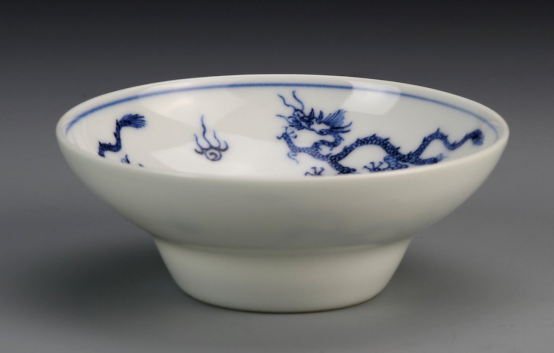 Chinese Blue and White Bowl: China, Qin period, blue and white dragon bowl, white ground color with three blue dragons and auspicious symbols inside bowl, with Yongzhan mark on bottom and of period. Height 4 in., Width 1 1/2 in.