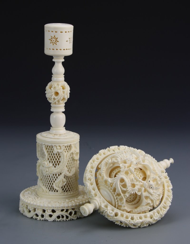 Chinese Ivory Ball on Stand: China, 19th C., intricately carved ivory ball on a stand, with carved inner balls and a dense design of openwork patterns overall. Height 15 in.
