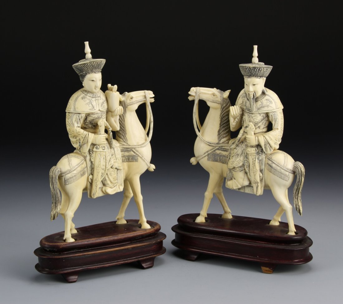 Pair of Chinese Ivory Figures on Horseback: China, 19th C., pair of well-carved ivory figures on horseback, each carrying a decorated sword, with carved wooden bases. Height 6 1/2 in. Provenance: From the private collection of Mrs. Pearl K. Jen