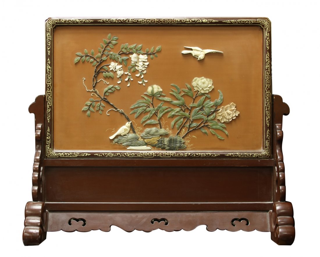 Chinese Table Screen: China, 19th C., table screen, decorated with scenes of flowers and birds, on an elaborately carved wooden stand. Length 32 in., Width 19 3/4 in. Provenance: From the private collection of Mrs. Pearl K