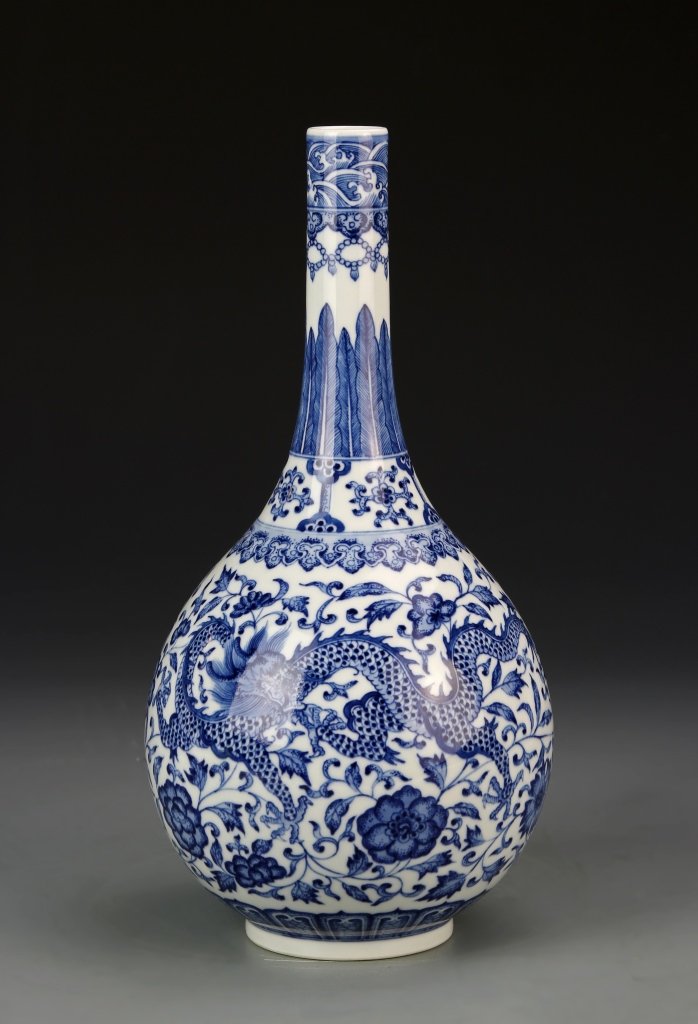 Chinese Blue and White Vase: China, blue and white vase, painted with an overall pattern of scrolling lotus flowers, and a five-clawed serpentine dragon, with Qianlong mark. Height 11 1/8 in.