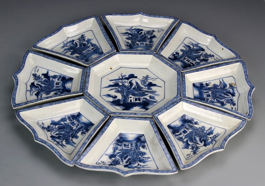 Set of Chinese Blue and White Dishes: China, 19th C., a set of blue and white dishes, when placed together form a larger charger, each decorated with a scene of buildings in a landscape setting. Diameter 13 3/4 in.