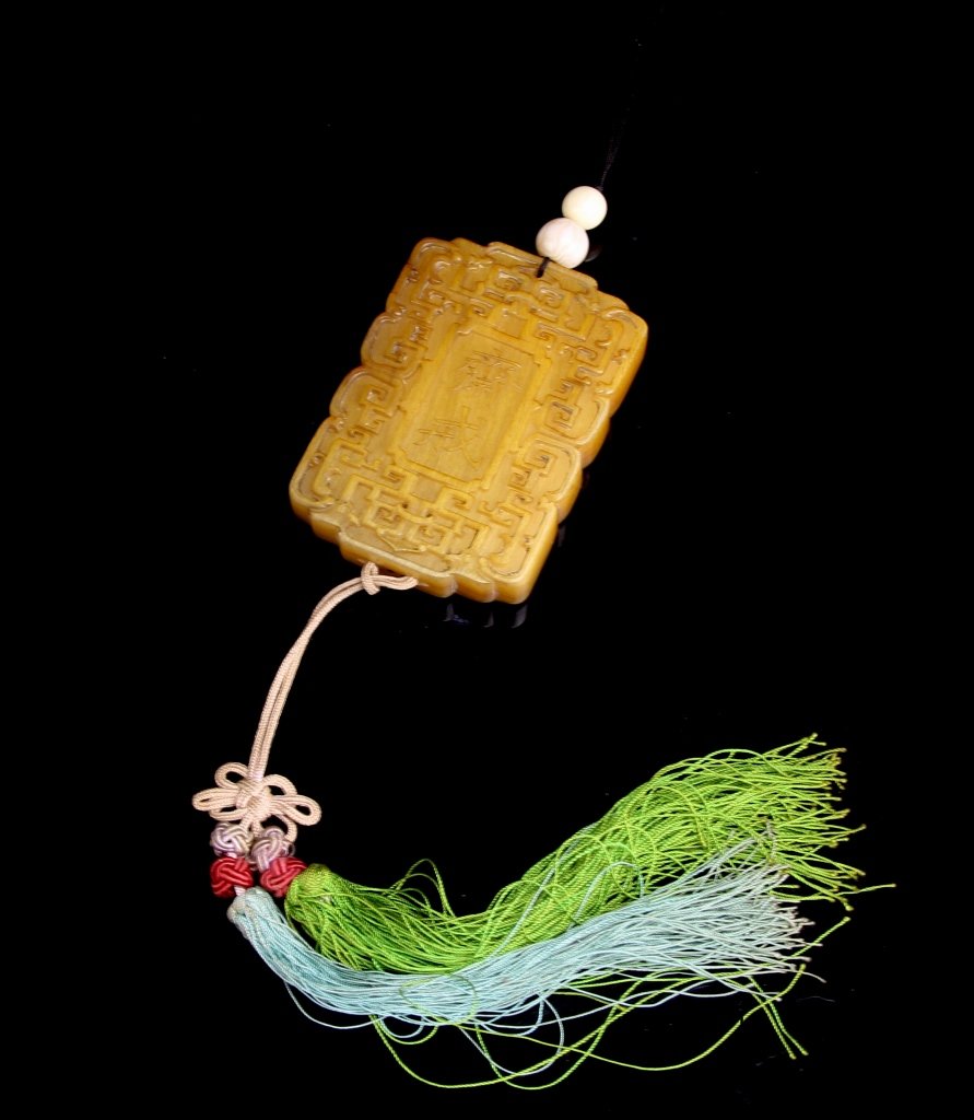 Chinese Horn Zhai-Jie Plaque: China, horn Zhai-Jie plaque, rectangular in form, carved with "Zhai Jie" on one side and Manchu inscription on reverse, each framed by intricate scroll borders, the horn of characteristic golden cinna