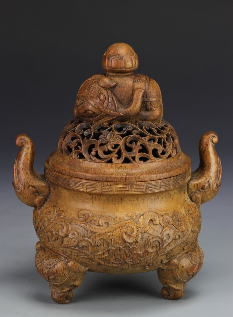 Chinese Carved Bamboo Tripod Censer: China, 19th C., carved bamboo tripod censer with cover, bulbous body carved in relief of a scrolling lotus, two raised elephant trunks as handles with three elephant heads as footings, cover pierced w