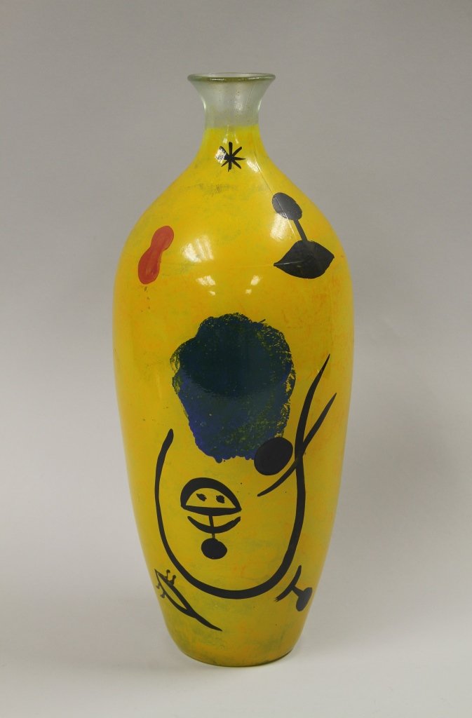 Modernist Vase: Modernist vase, cylindrical in form with wide shoulder and narrow neck, painted glass in a yellow ground, symbols painted on body in bold colors, singed "V". Height 15 in.