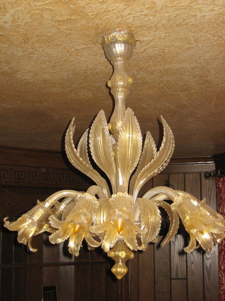 Italian Murano Glass Chandelier: Italy, antique Murano glass chandelier of floral design with hanging tulip shaped globes, in soft gold glass color. Height 33 in., Width 28 3/4 in. Provenance: From the estate of Nick Sampson, Uxbridg