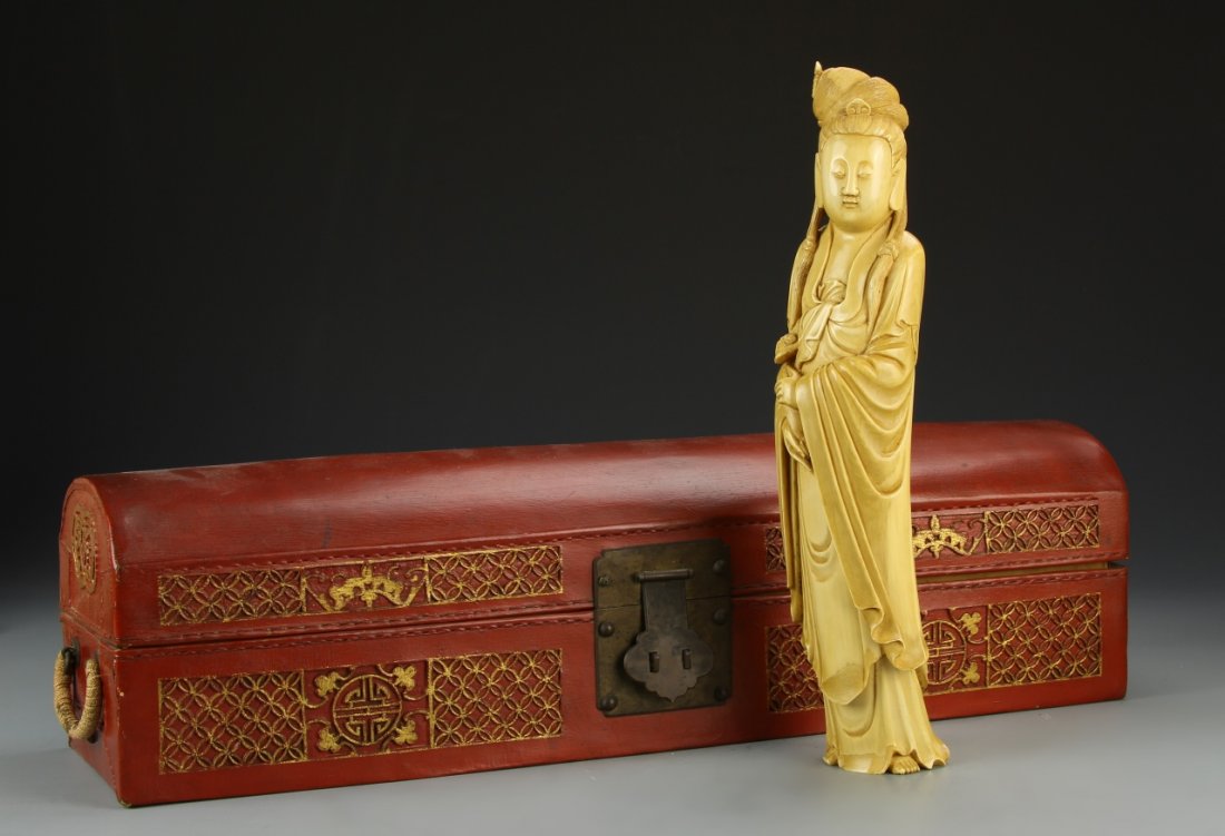 Japanese Ivory Figure: Japan, 19th C., ivory figure of a female, carved to show detail in the robes and headdress of the figure, with red and gilt box. Height 11 1/2 in. Provenance: From the private collection of Mrs. Pearl