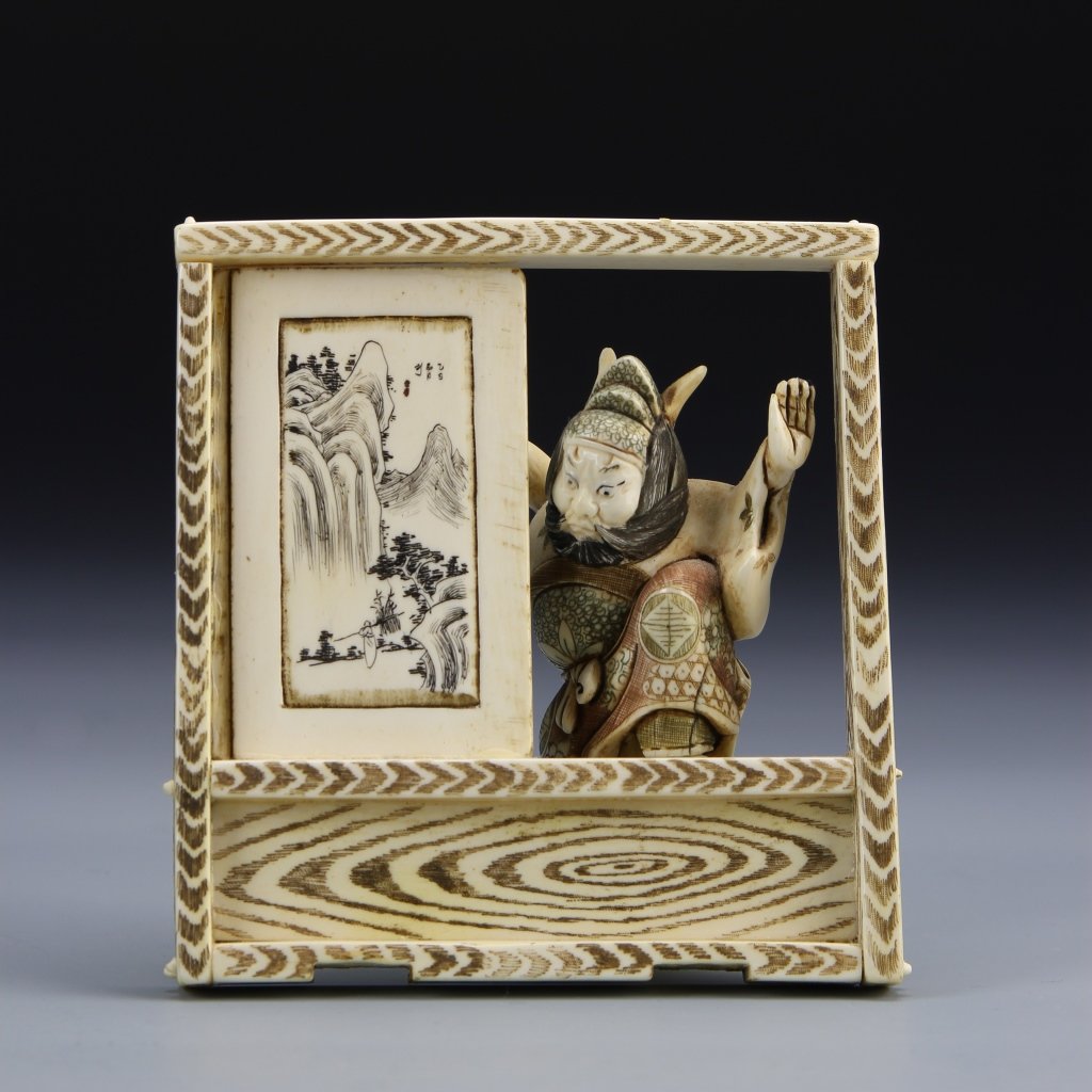 Japanese Ivory Show Stand: Japan, 19th C., ivory show stand, square in form, panel on stand showing a landscape scene, figure peering out of open panel. Height 7 1/2 in., Length 6 1/2 in. Provenance: From the private collection