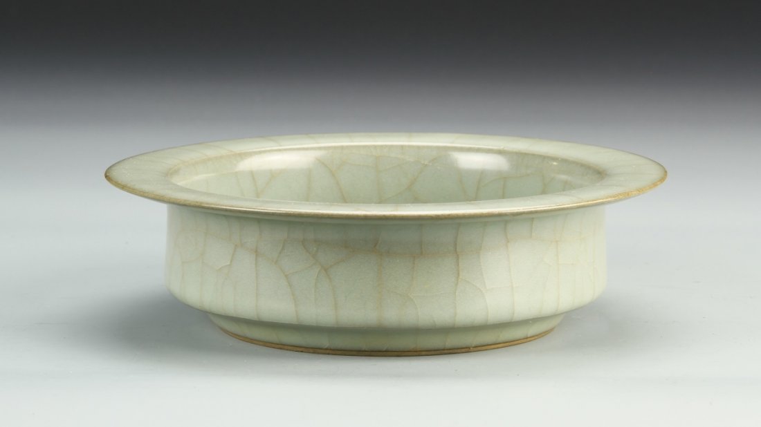 Chinese Guan-Type Lungquan Washer: China, Guan-type Lungquan washer, upright sides angled above the recessed foot and tapering toward the everted rim, the body covered with rich smooth sea-green glaze filled with dark and gold crackle.