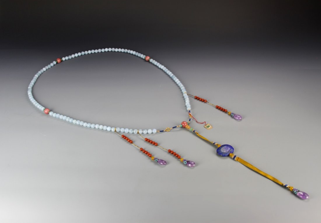 Imperial Court Lady's (Hailanbao) Chaozhu: Imperial court lady's chaozhu, consisting of a string of 108 semi-translucent sky blue aquamarine (hailanbao) beads, spaced with four large pink tourmaline beads, and a lapis lazuli beiyun pendant, to