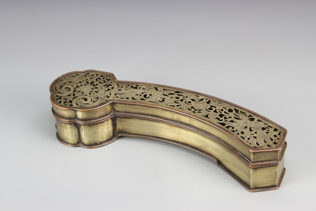 Chinese Incense Burner: China, 19th C., bronze and white copper incense burner in the form of a stylized ruyi scepter, the top with pierced work throughout, decorated with phoenixes and lotus blossoms throughout. Length 10 i