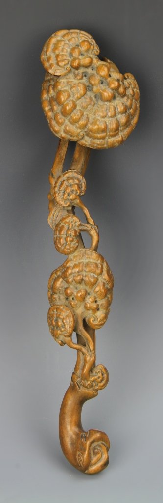 Chinese Boxwood Ruyi Scepter: China, 19th C., boxwood ruyi scepter, in a naturalistic wood form, with visible grain showing, and carved plant life motifs. Height 10 3/4 in.