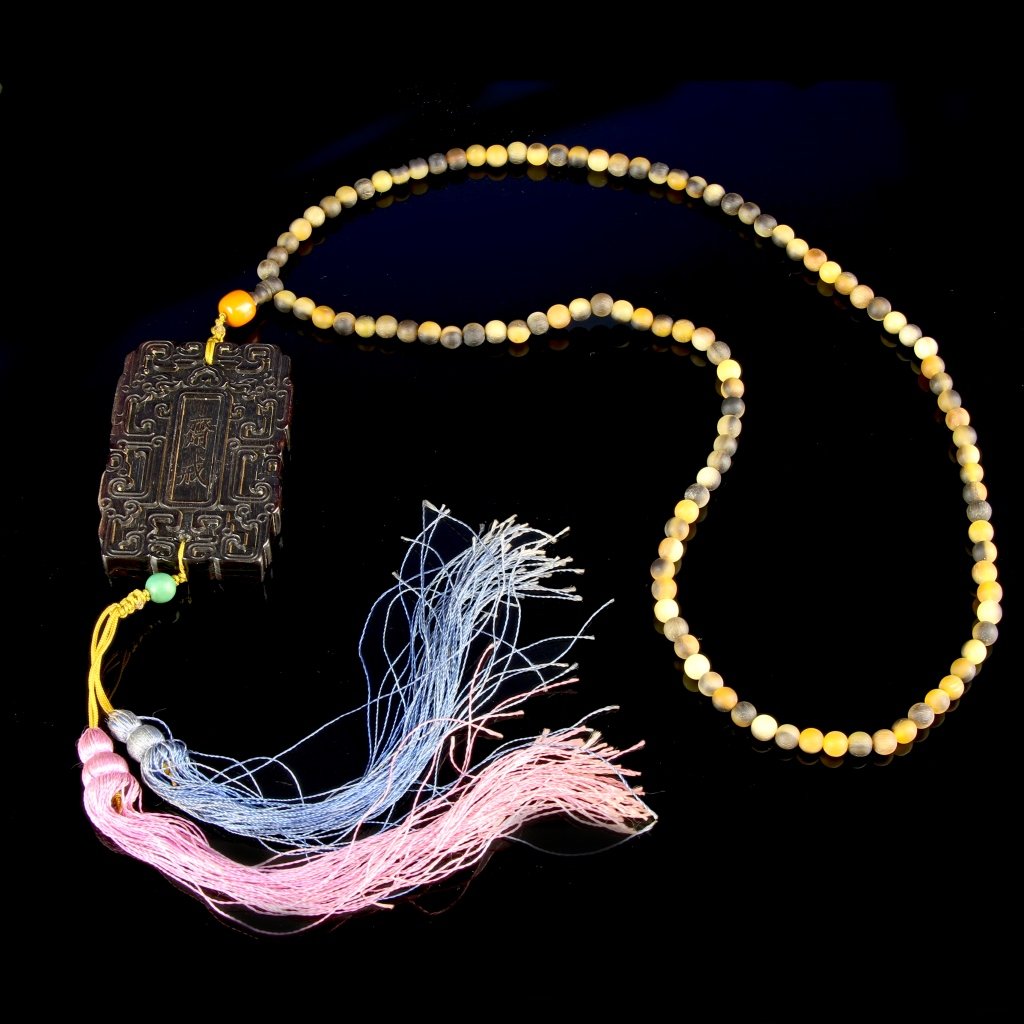 Chinese Carved Horn Zhaijie Plaque Necklace: China, carved horn Zhaijie plaque necklace, rectangular form carved with zhaijie characters on one side and Manchu characters on the reverse, bordered by chi-dragons, attached with horn bead necklace.