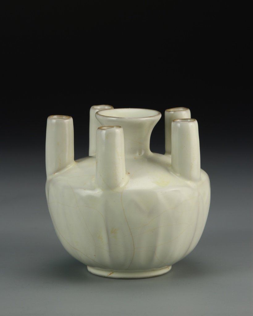 Chinese Ding Type Porcelain Vase: China, Ding type porcelain vase, compressed round body molded with short-flared upright lappets mounted together with five tube openings. Diameter 4 1/2 in.