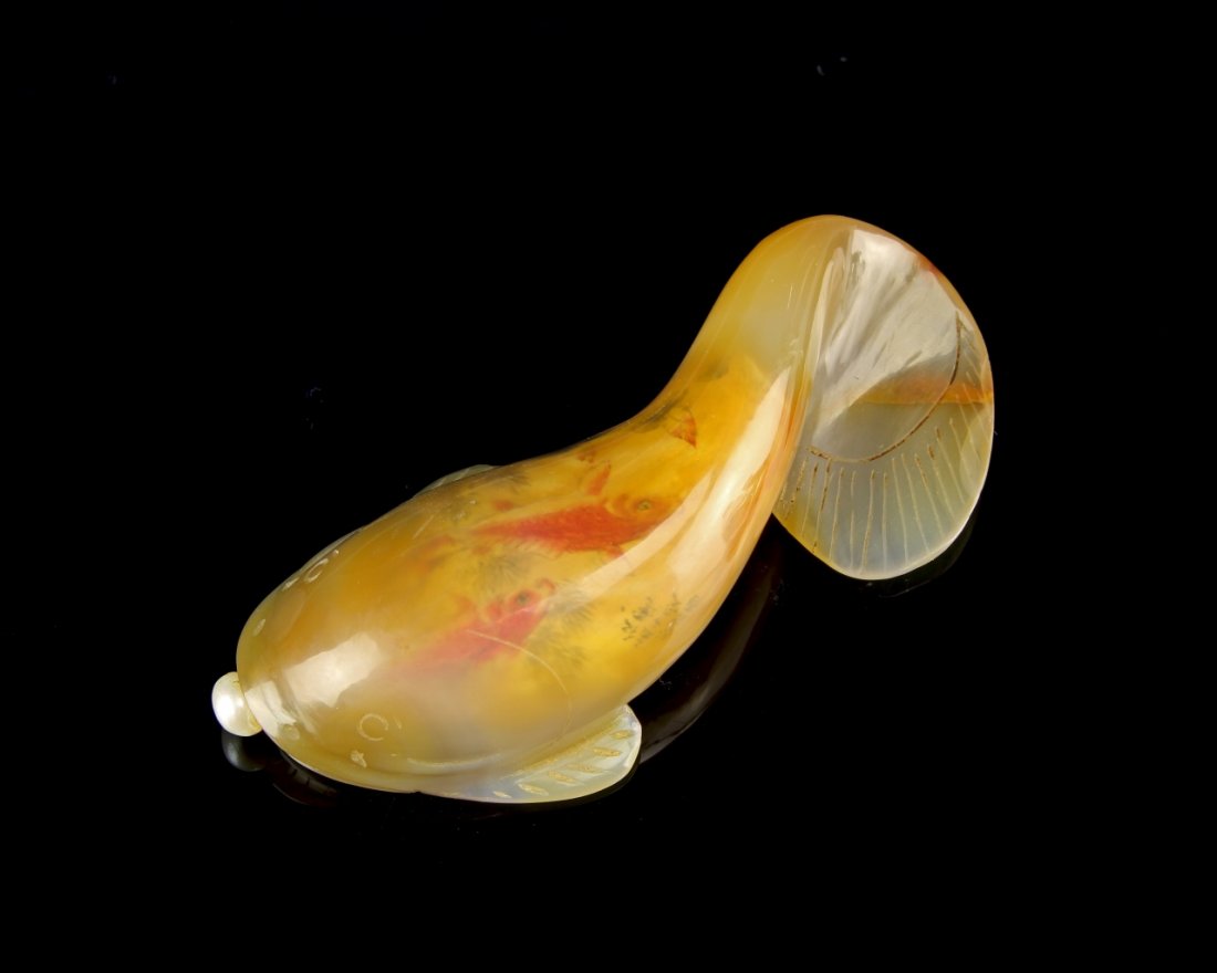 Chinese Painted Agate Snuff Bottle: China, 19th C., inside-painted agate snuff bottle, the form of a koi fish, light orange translucent color, painted design on the interior. Height 4 in.