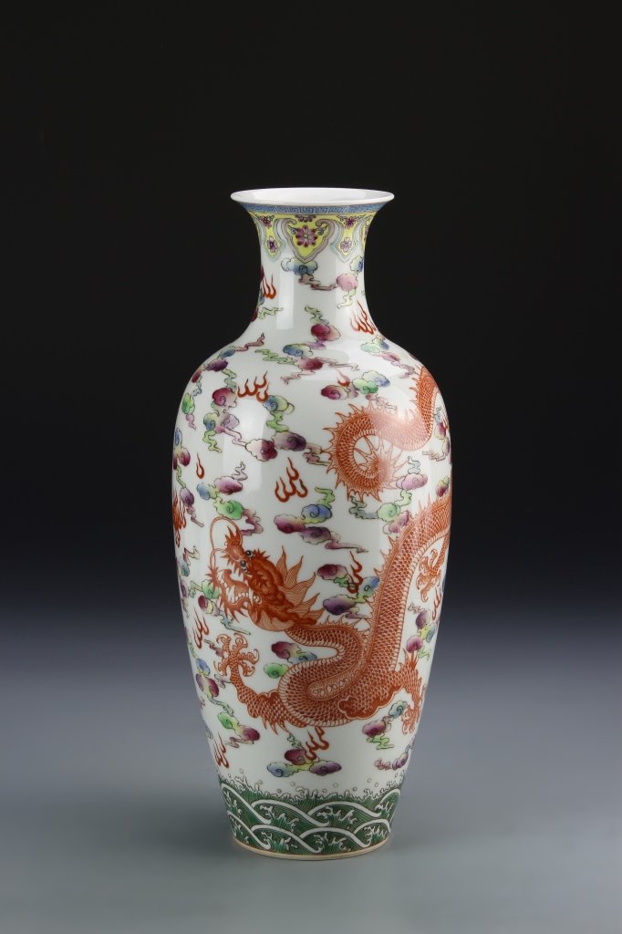 Chinese Famille Rose Vase: China, Famille Rose Vase, tapering from the base to the high shoulder, flared rim, and colorful dragon motifs, Guangxin mark on base. Height 12 in.
