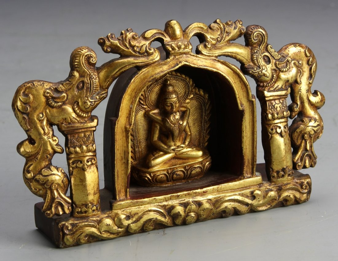 Chinese Gilt Bronze Buddha: China, gilt-bronze Buddha figure, Shakti Buddah seated within an altar style frame, decorated with climbing dragons. Height 6 in., Width 4 in.