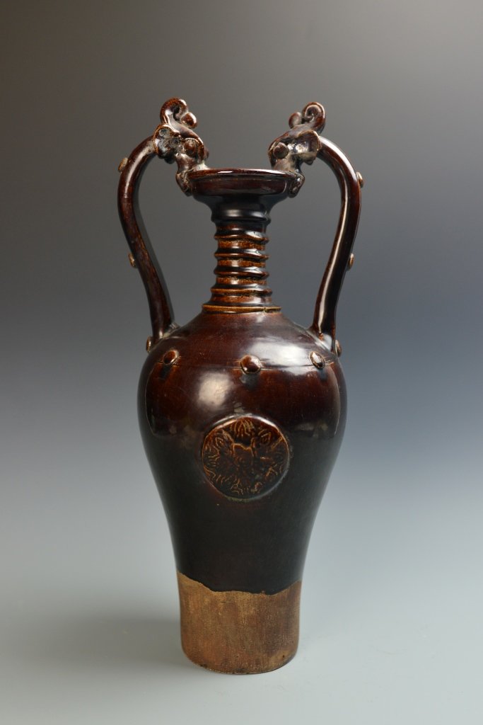 Chinese Antique Brown-Glazed Vase: China, antique brown-glazed vase with dragon handles, high shoulder with narrow neck, with layered surface, in brown hue. Height 18 3/4 in.