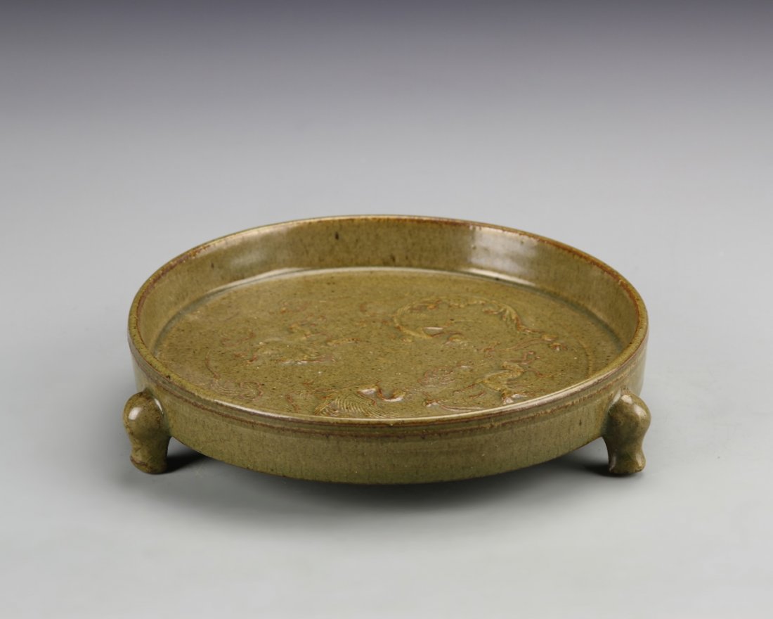 Chinese Antique Tripod Brush Washer: China, antique tripod brush washer, tri-foot, on short legs with rounded feet, shallow with low sides, light green hue, with dragon motifs. Diameter 7 in., Height 1 3/8 in.
