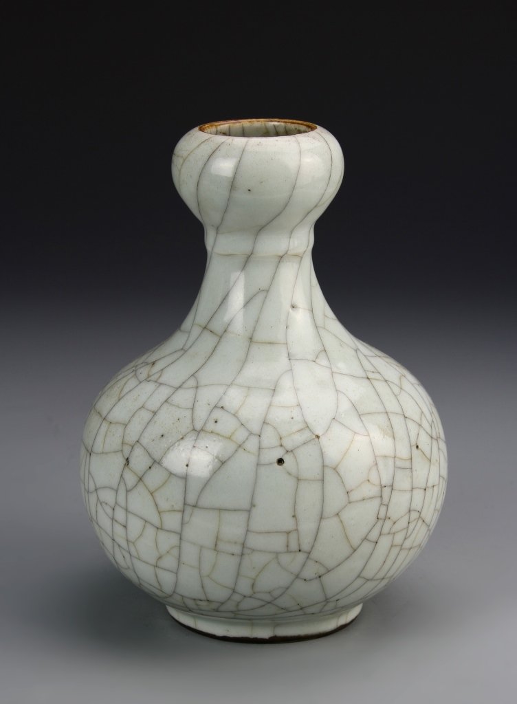 Chinese Ge Ware Square Vase: China, antique glazed Ge ware garlic head vase, with bulbous body, flared neck, garlic head rim and slightly footed base, white crackle glaze throughout. Height 7 1/4 in.