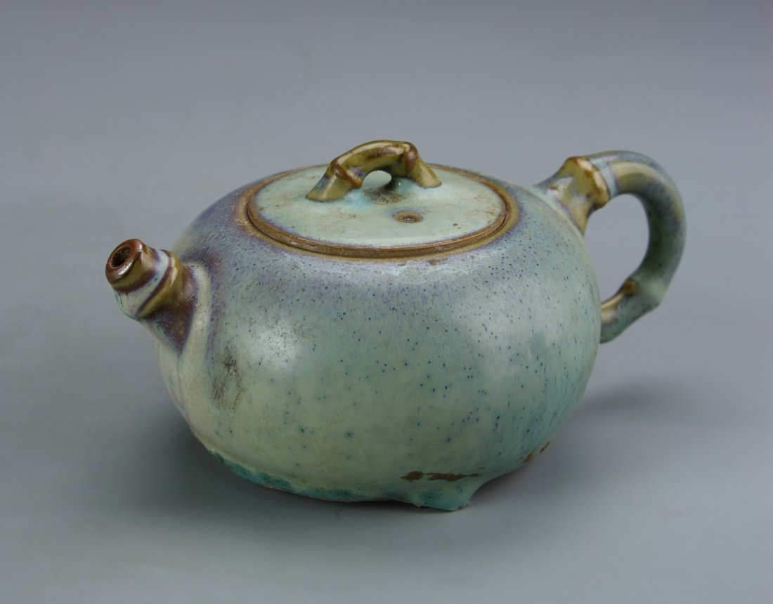 Chinese Jun Ware Teapot: China, antique Jun Ware teapot, in rounded form, with blue and purple mottled glaze, footed base, and bamboo formed handle and knop. Height 2 1/2 in., Width 5 1/4 in