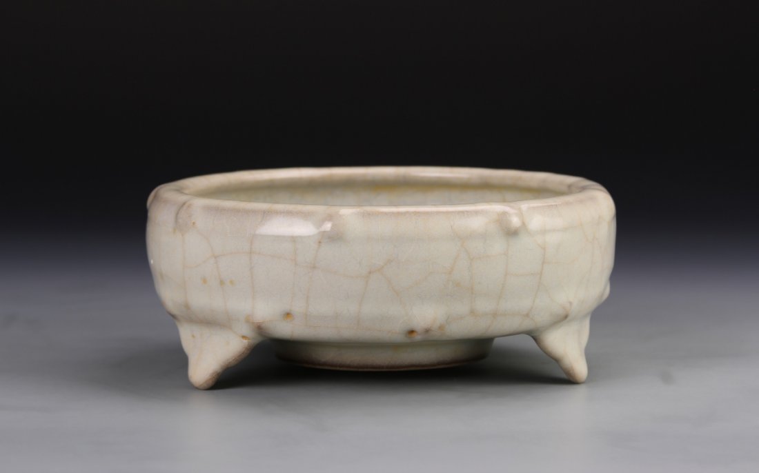 Chinese Guan-Type Brush Washer: China, Song Dynasty, Guan-type brush washer, the circular body decorated with band of raised bosses beneath the rim, and supported on three ruyi shaped legs, covered all over with rich smooth gray-blu