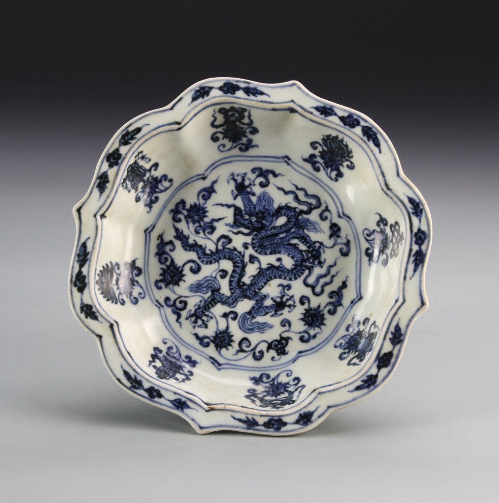 Chinese Blue and White Plate: China, Ming Period, blue and white plate, circular form, with high sides and scalloped edges, white ground, with painted five clawed dragon motif on interior, Xuande mark. Diameter 8 in., Height 1 1/2