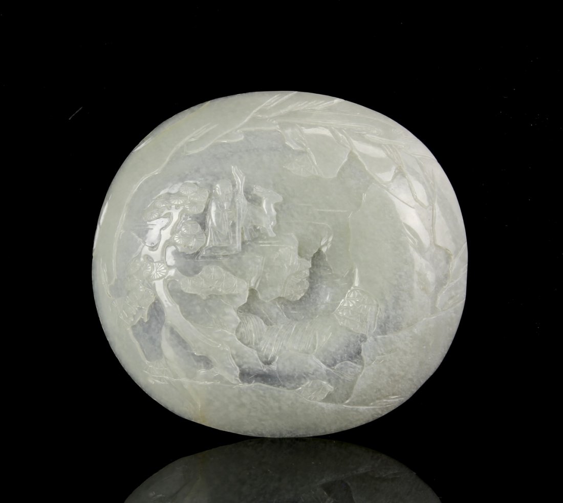 Chinese Jade Ornament: China, jade ornament, carved in a circular form, illustration depicting a robed figure and a deer, in a landscape setting, on the exterior surface, in an icy white hue. Height 5 1/2 in. Provenance: Pr