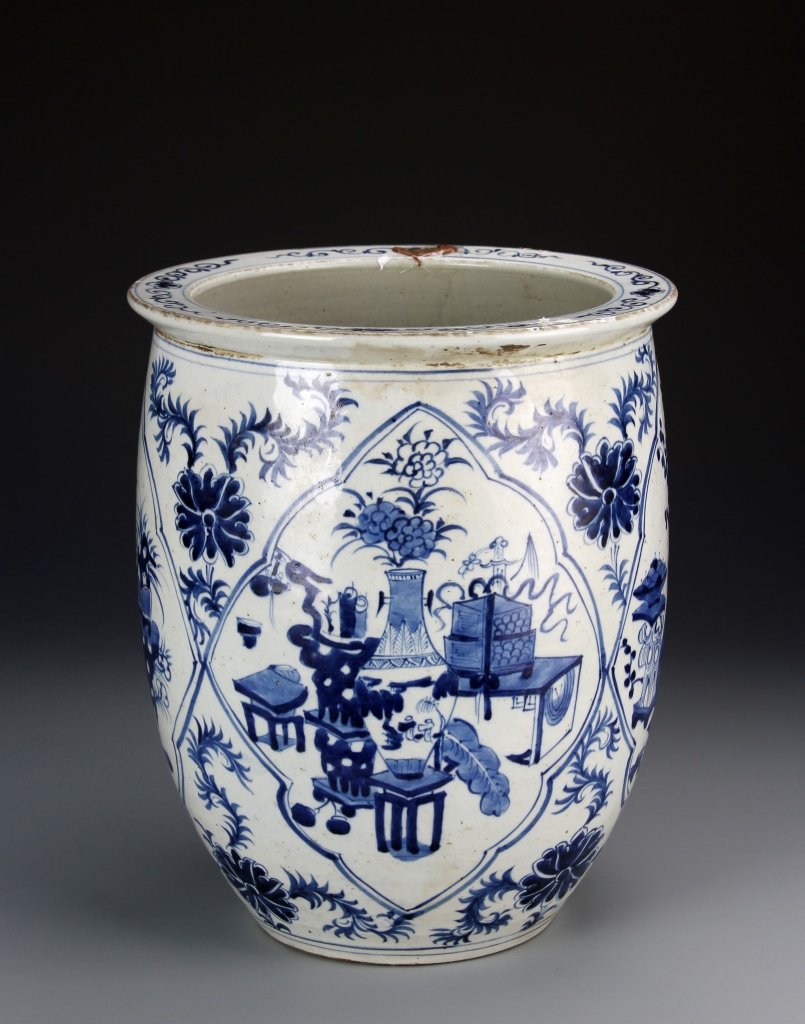 Chinese Blue and White Floral Basin: China, 19th C., blue and white floral basin, decorated with a medallion scene of wooden stands and other ceramic vessels holding plants. Height 12 3/4 in., Width 10 5/8 in.